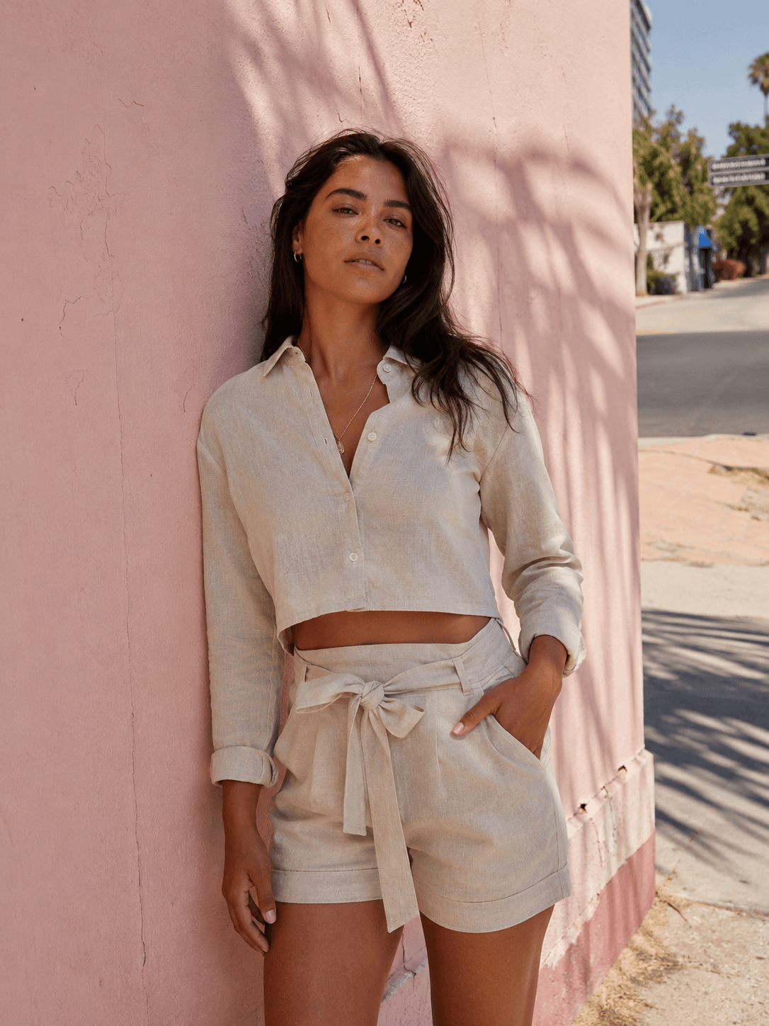 Wholesale coord set manufacturer matching linen shorts and cropped shirt set worn by model on LA Silverlake street